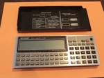 Vintage Sharp PC-1350 Basic Pocket Computer W/8K Ram Card. Fixed Price $175.00.