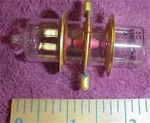 One 702B Odd Radar Spark Gap Tube Gold Flange Sylvania Vintage WW2. Fixed Price $23.50.